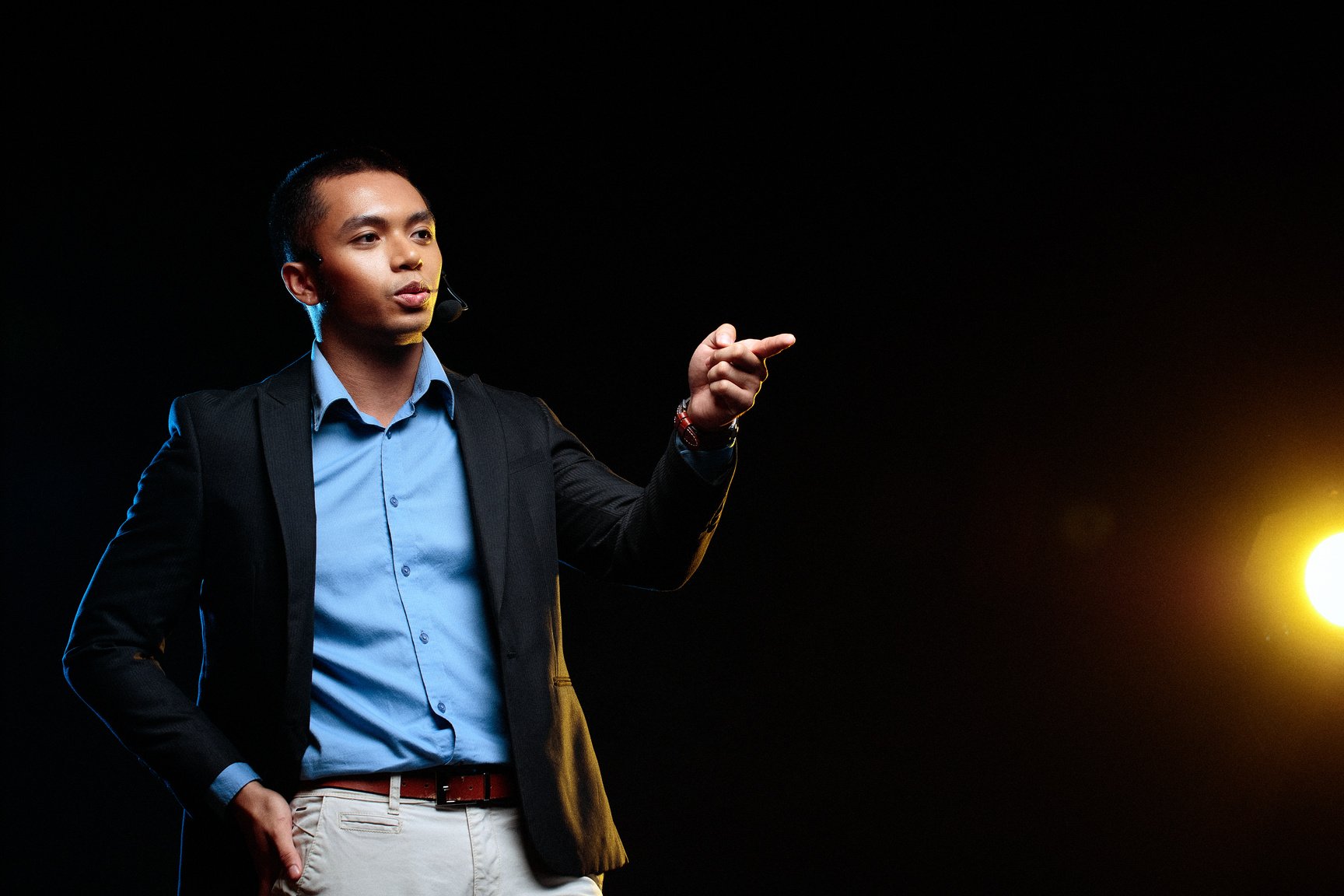 Man Giving a Talk in Public on Stage